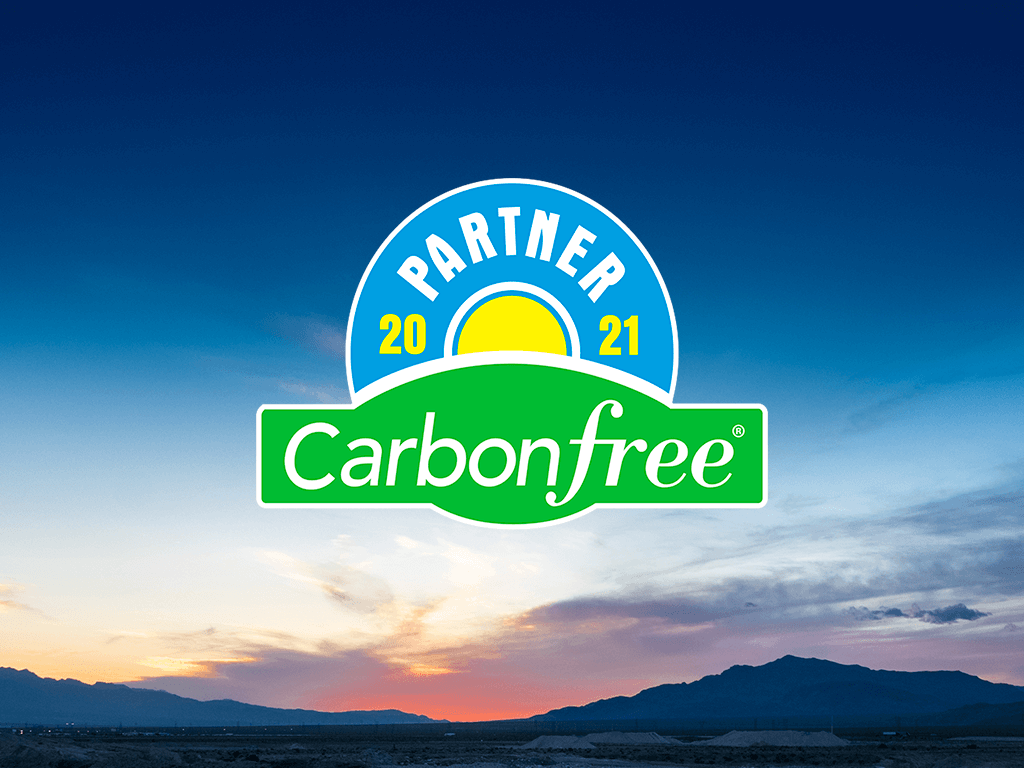 Carbonfree Partner 2021 badge with sunset background